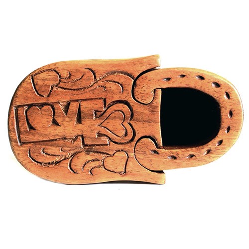 A wooden padlock-shaped object engraved with the word "LOVE" and decorative heart motifs remains closed, set against a white background.