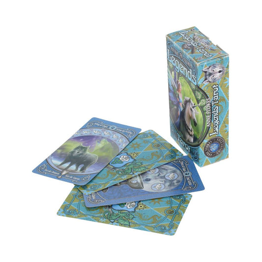 Deck of blue Legends Tarot cards fanned on a white surface as the matching box labeled "Legends Tarot" and "Anne Stokes" stands upright; a visible card reads "King of Cups."