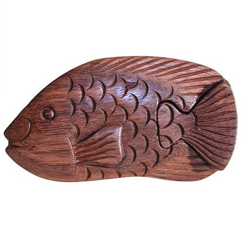 A wooden fish sculpture displays intricate carved scales and fins, set against a plain white background. The craftsmanship highlights natural wood grain, emphasizing artistic intricacy and texture.