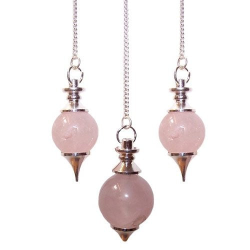Three rose quartz pendulums hang from silver chains against a white background. Each pendulum features a sphere topped with silver accents and a pointed end.