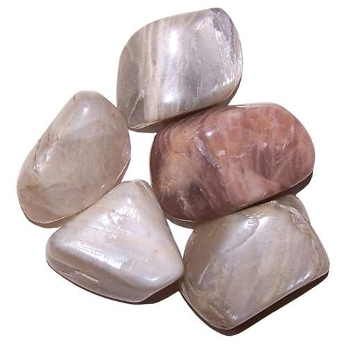 A collection of five polished, rounded stones lies together. The stones are primarily pearlescent and light-colored, but one is a warm, marbled rose color.