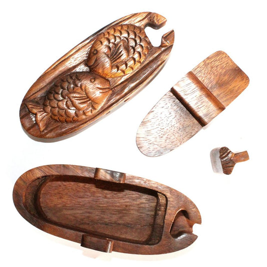 Wooden puzzle box shaped like a fish, disassembled into four pieces, including a carved fish top and fitted base, placed on a white background.