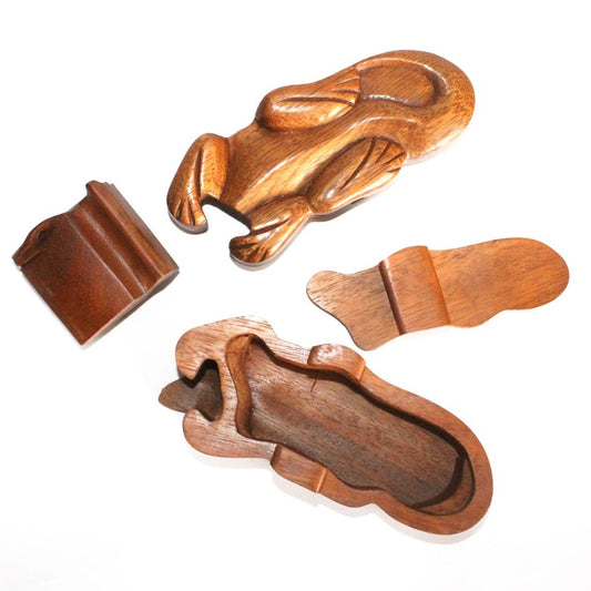 Wooden puzzle box shaped like a platypus, disassembled into separate pieces, including a lid and internal compartments, displayed on a white background.