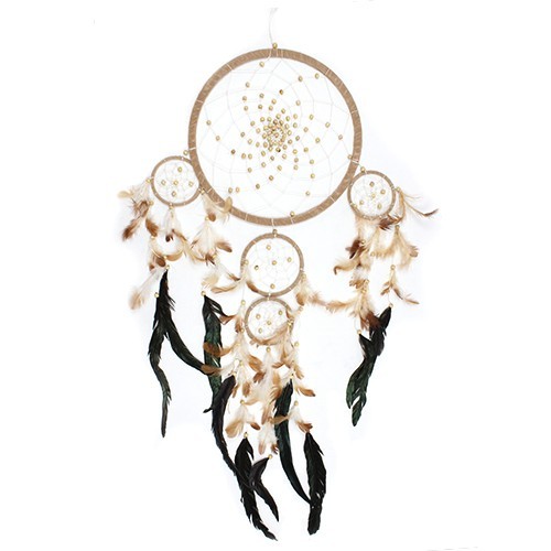 A large beige dreamcatcher, adorned with beads and feathers in tan and dark green, hangs against a white background.