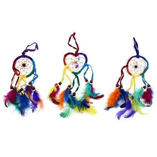 Three rainbow-colored dreamcatchers, one circular, one heart-shaped, and one circular, hang against a white background. Each is adorned with colorful feathers.