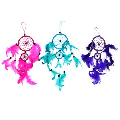 Three dreamcatchers hang against a white background. Each features a circular net adorned with feathers in pink, teal, and purple.