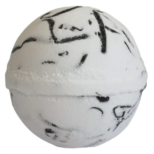 A white, spherical bath bomb with irregular black streaks rests on a plain white background.