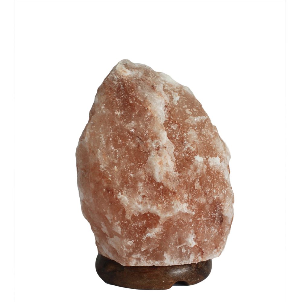 A large, rough-textured pink salt rock rests on a dark wooden base. The background is plain white, emphasizing the rock's natural crystalline appearance.