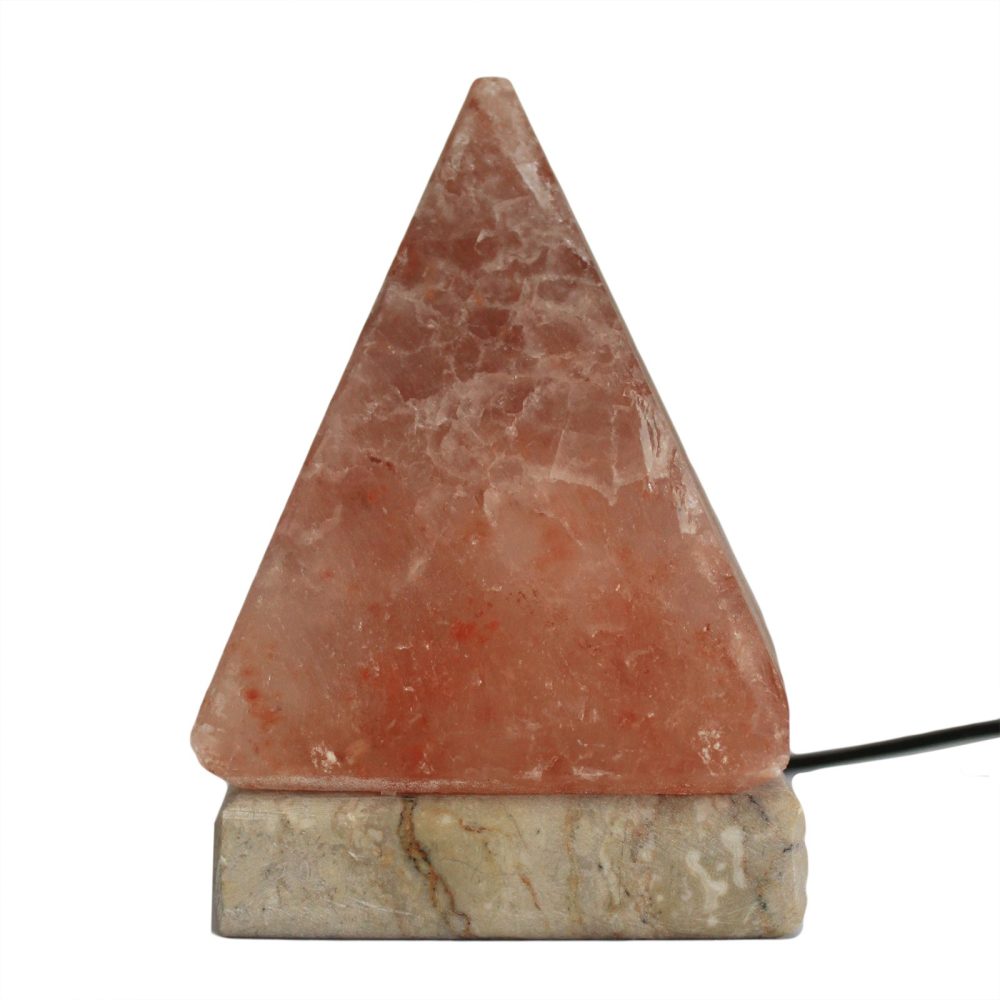 Pyramid-shaped pink salt lamp sits on a stone base, with a black cord extending from the right side, isolated against a white background.