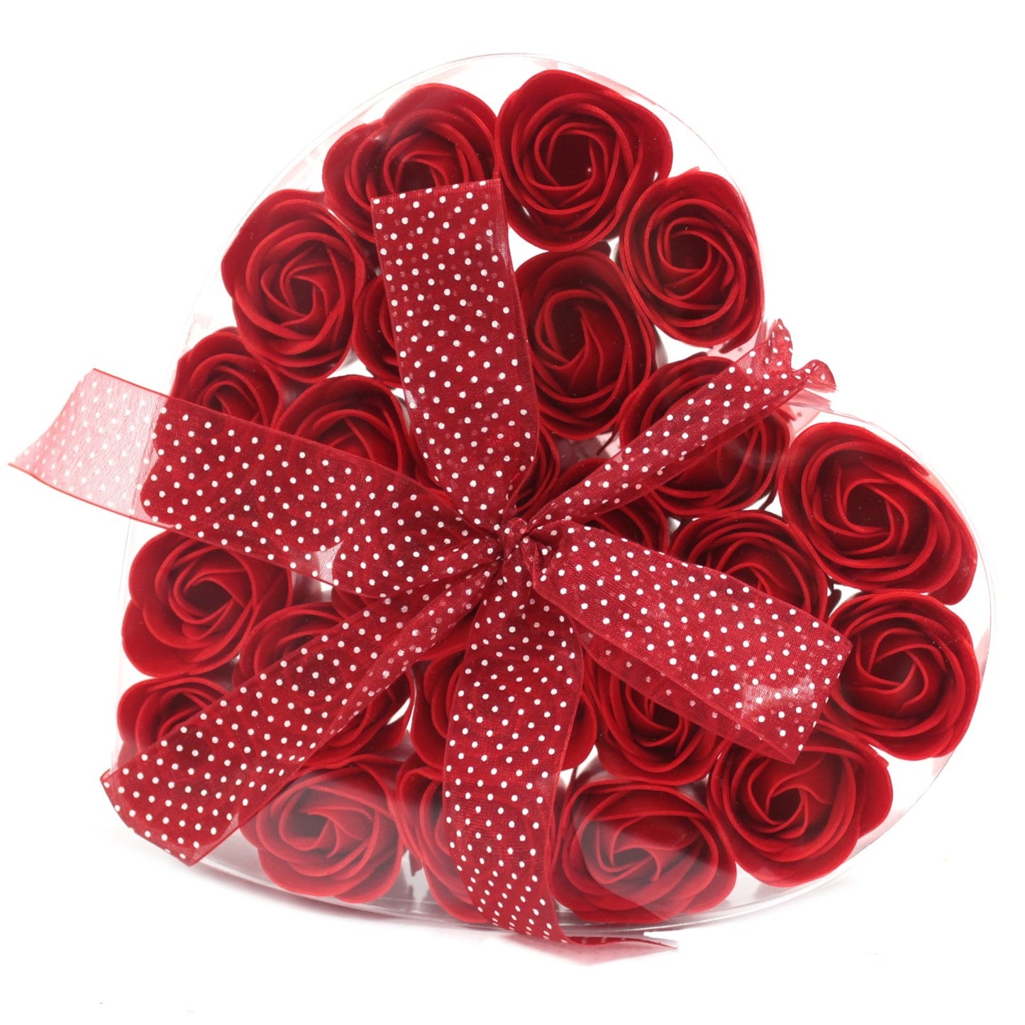 A heart-shaped box filled with red roses is tied with a red-and-white polka-dot ribbon. The box is set against a white background.