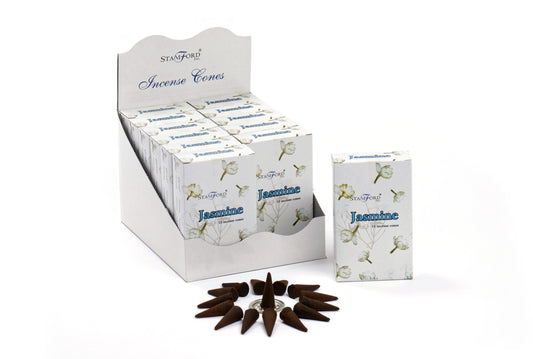 Incense cones in a white display box are labeled "STAMFORD Inc. Jasmine." One box is outside the display, surrounded by arranged brown cones on a white surface.