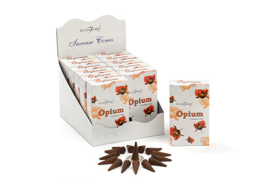 Boxes of Stamford Inc. Opium incense cones are displayed in a white holder, featuring decorative orange flowers. Fifteen brown incense cones are arranged in a circular pattern in front.