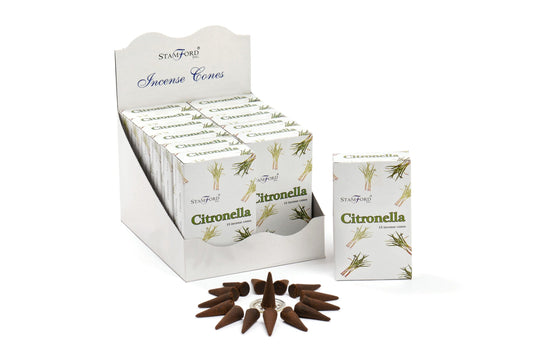 Incense cones branded "Stamford Incense Cones" are displayed in a white box labeled "Citronella." The box holds multiple smaller boxes, each featuring a lemongrass design. Loose cones encircle a small metal holder.