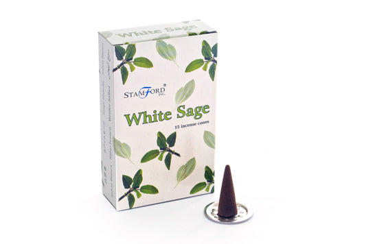 A box labeled "Stamford Inc. White Sage, 15 incense cones," illustrated with sage leaves. Adjacent, a brown incense cone is positioned on a small metallic stand against a white backdrop.