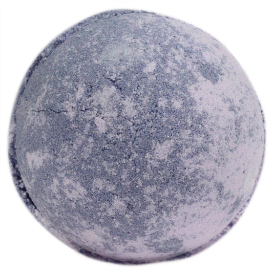 A round bath bomb with a speckled, marbled blue and white surface sits against a plain white background, appearing textured and slightly cracked.