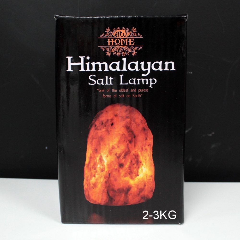 Himalayan Salt Lamp packaging showing an illuminated salt lamp on a black background. Text reads: "AW Home. Himalayan Salt Lamp. 'one of the oldest and purest forms of salt on Earth'. 2-3KG."