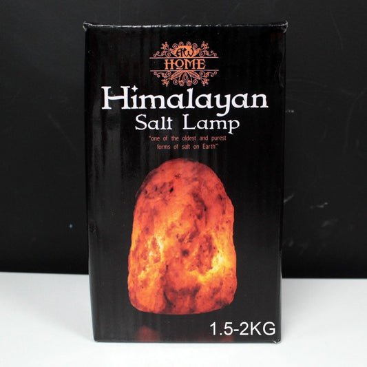 A glowing Himalayan salt lamp is displayed on a black box with white text: "AW Home Himalayan Salt Lamp, 'one of the oldest and purest forms of salt on Earth,' 1.5-2KG."