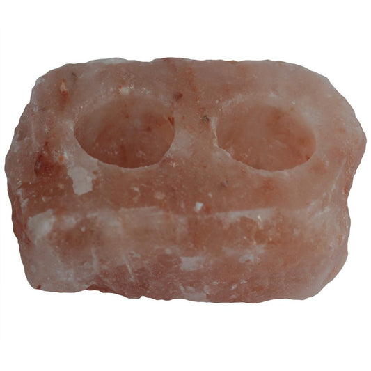 Pink Himalayan salt block with rough, irregular rectangular shape featuring two drilled circular cavities for tealights or small candles, shown isolated against a white background.