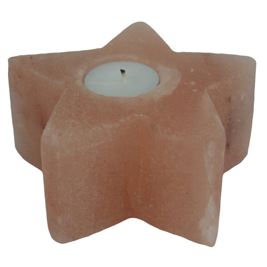 Star-shaped pink salt tealight holder cradles an unlit white tealight candle against a plain white background.
