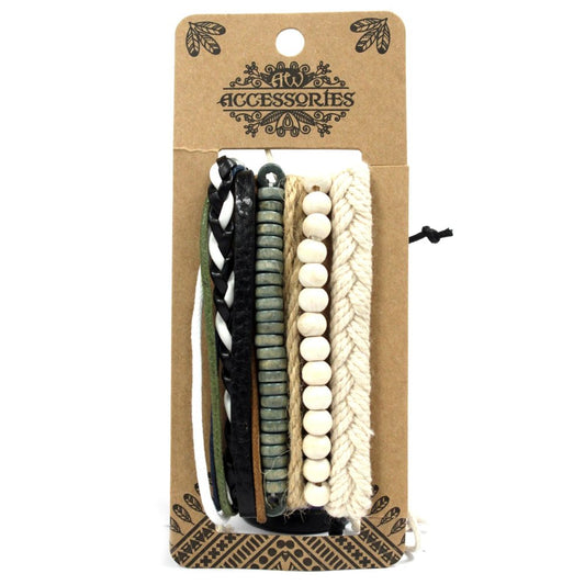 Bracelets are stacked on a cardboard display card reading "Accessories". There are five bracelets: thin green, white, and black faux leather strands; a strand of green and brown beads; and a braided rope strand.