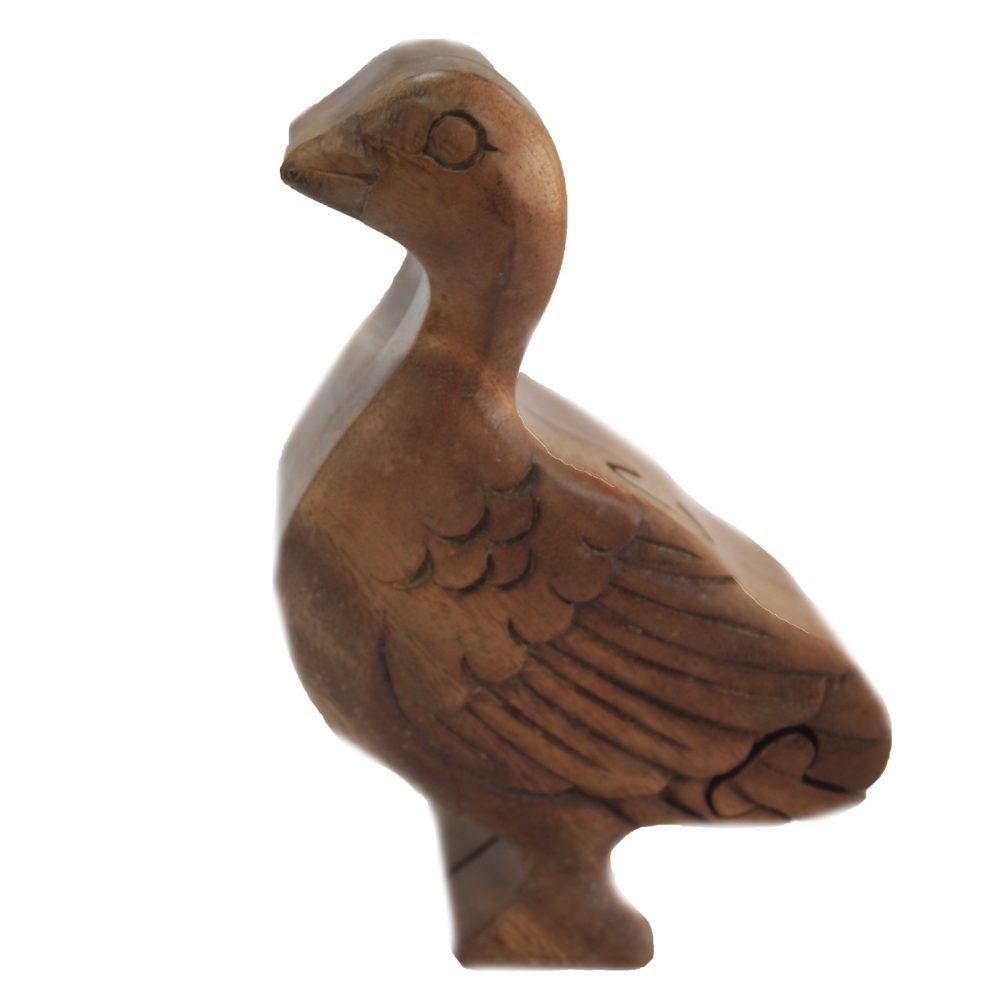 A wooden duck sculpture stands still, showcasing carved wing details. It is isolated against a plain white background, highlighting its rustic texture and natural wood color.