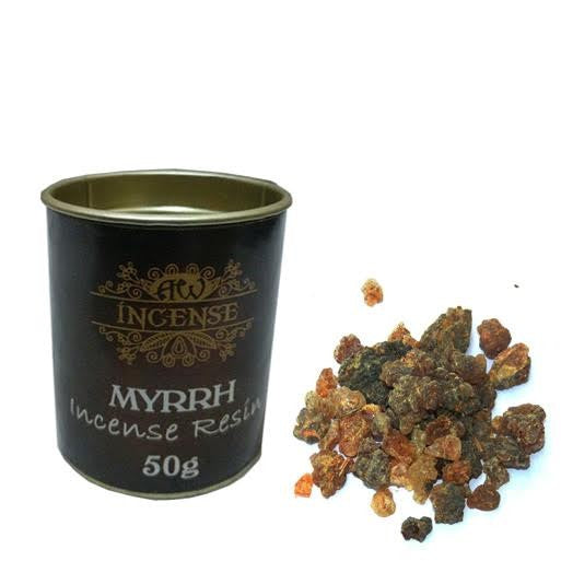 Container labeled "AW INCENSE MYRRH Incense Resin 50g" accompanied by a pile of amber and brown resin chunks on a white background.