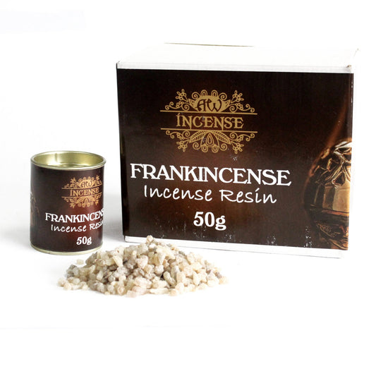 Container and box display "Frankincense Incense Resin 50g" with ornate design. Pile of small, beige resin pieces lies beside them on a white surface.