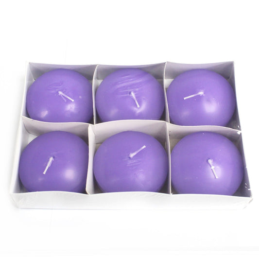 Six purple spherical candles arranged in two rows of three, each with a short white wick, placed in a white divided cardboard tray on a white background.