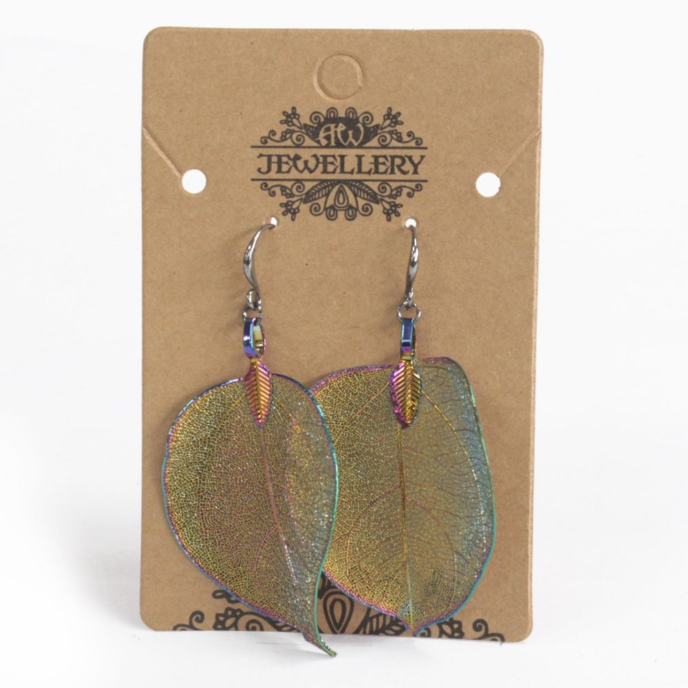 Leaf earrings dangle on hooks attached to a display card with "JW JEWELLERY" printed above a decorative flourish, set against a white background.