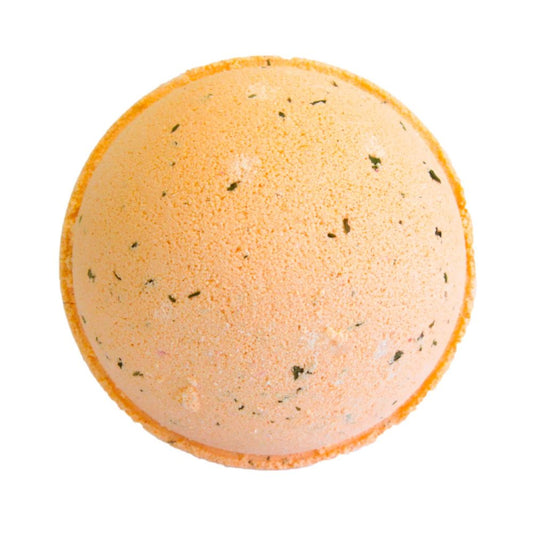 An orange, spherical bath bomb with speckled green flecks rests against a white background, ready for use.