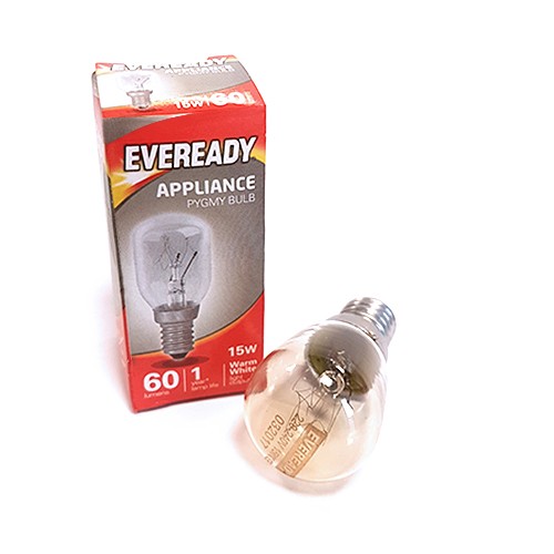 An Eveready 15W pygmy bulb lies beside its red box labeled "APPLIANCE," "60 Lumens," and "Warm White." The bulb features a visible filament and metal screw base.