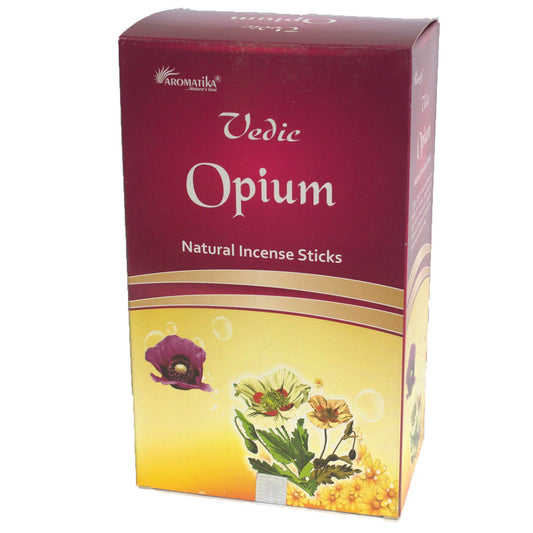 A box labeled "Vedic Opium Natural Incense Sticks" displays floral illustrations against a gradient red-to-yellow background, with branding "AROMATIKA" at the top.
