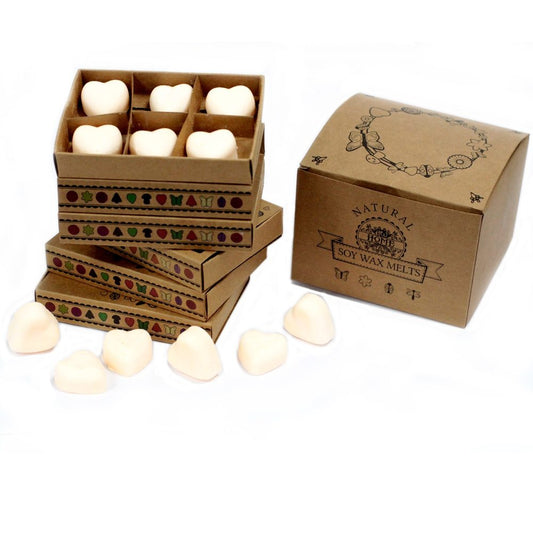 Heart-shaped soy wax melts are stacked in decorated boxes; several additional melts sit beside a larger, similarly decorated box. NATURAL SOY WAX MELTS.