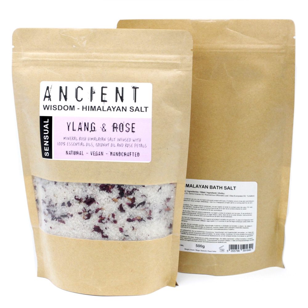 Two stand-up kraft pouches, one slightly behind the other, contain Himalayan bath salt. The labels read: “ANCIENT WISDOM - HIMALAYAN SALT”, “SENSUAL”, “YLANG & ROSE”, and “MALAYAN BATH SALT”.