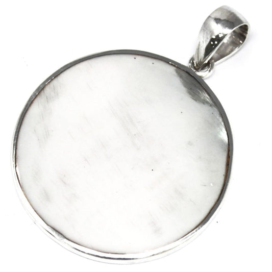 A silver pendant with a large, circular, milky-white stone is suspended. A loop extends from the top, all set against a bright white background.