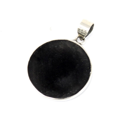 A circular, black pendant with a silver loop marked "925" sits angled in a white space.