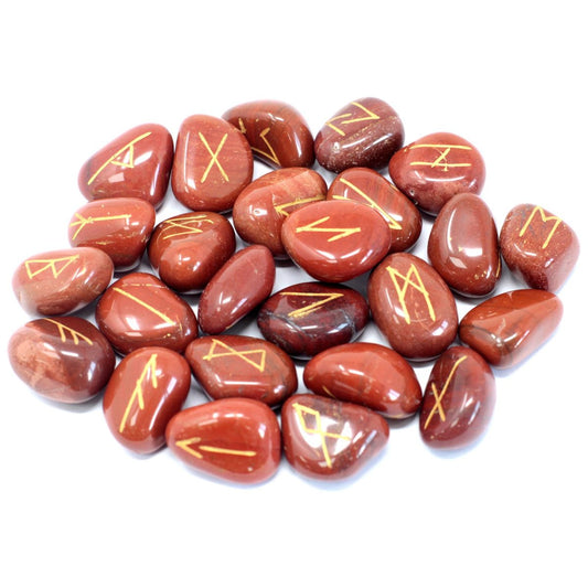Rounded, red-brown stones are scattered. Each features a gold-colored symbol of varying shape. The stones are situated on a solid white background.