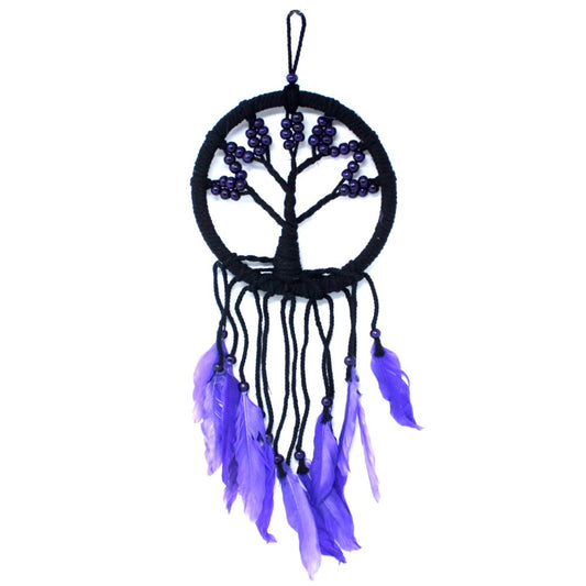 A black circular dreamcatcher, adorned with purple beads forming a tree and purple feathers, hangs against a white background.