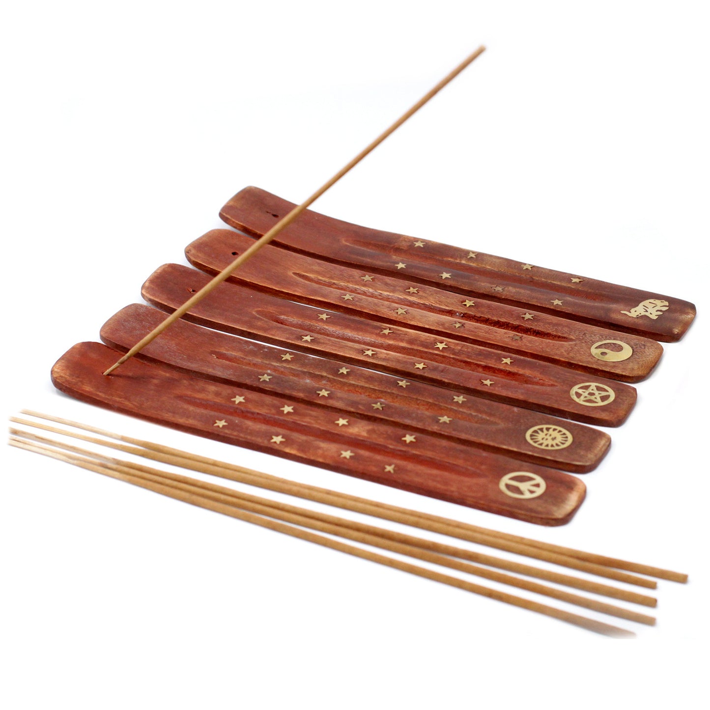 Wooden incense holders display symbols and star patterns. One holds an incense stick, while others lie nearby with additional sticks, set on a white background.