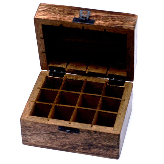A wooden box, open, displays an array of twelve compartments inside. The box rests on a plain white surface.