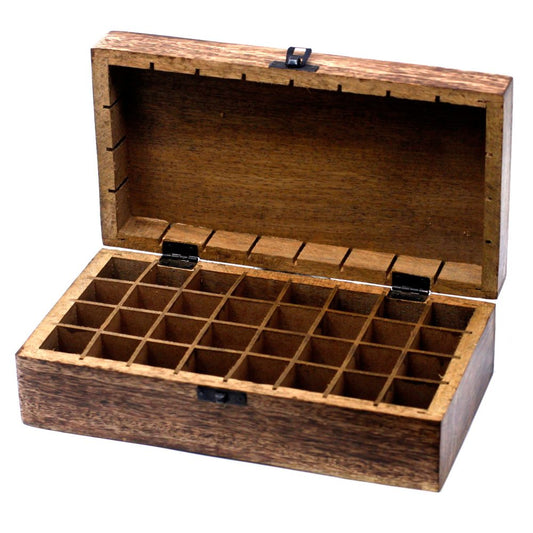 A dark-stained wooden box is open, revealing a grid of 5x7 compartments inside. The box sits on a white surface.