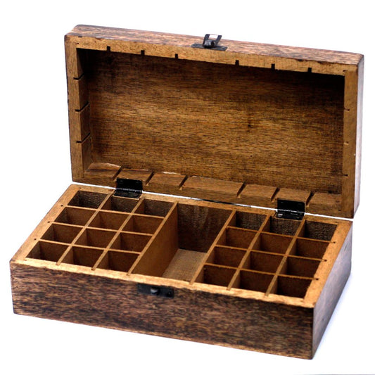 A wooden box with metal hinges stands open, revealing an interior divided into numerous small compartments. It sits on a white surface.