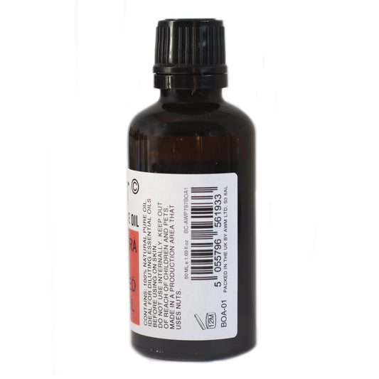 The dark-brown glass bottle, set on a white surface, displays the label which includes, “CONTAINS: 100% NATURAL PURE OIL. IDEAL FOR DILUTING ESSENTIAL OILS BEFORE USING ON SKIN. DO NOT USE INTERNALLY. KEEP OUT OF REACH OF CHILDREN AND PETS. MADE IN A PRODUCTION AREA THAT USES NUTS. 50 ML e 1.69 fl oz BC-AWP797BOA1 12M BOA-01 5055796 561933 PACKED IN THE UK BY AWM LTD, S3 8AL.”