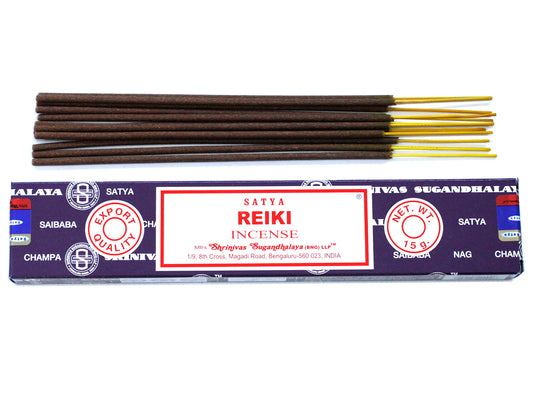 Incense sticks rest atop a purple box labeled "Satya Reiki Incense." The box details: "EXPORT QUALITY," "NET WT. 15 g," and "Shrinivas Sugandhalaya (BNG) LLP, Bengaluru, India."