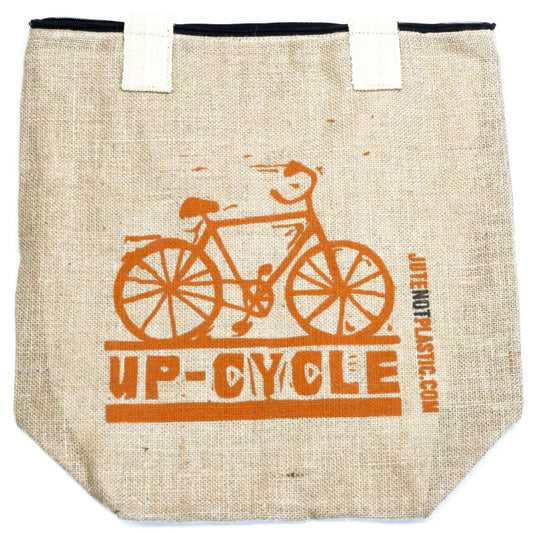 The burlap tote features a stenciled orange bike graphic above "UP-CYCLE," and "JUTENOTPLASTIC.COM" vertically on the right. It has white handles and a black zipper on top.