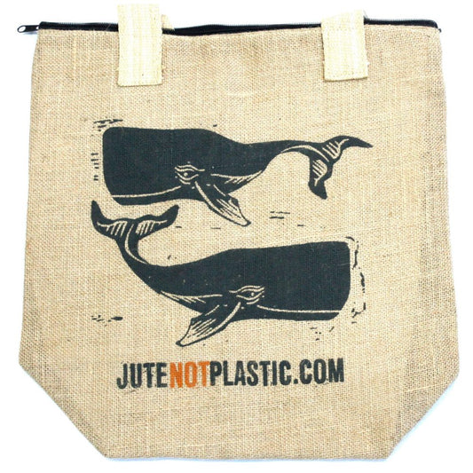 A burlap tote bag displays two stylized whales swimming. “JUTENOTPLASTIC.COM” is printed along the bottom, and it has white handles with a black zipper closure at the top.