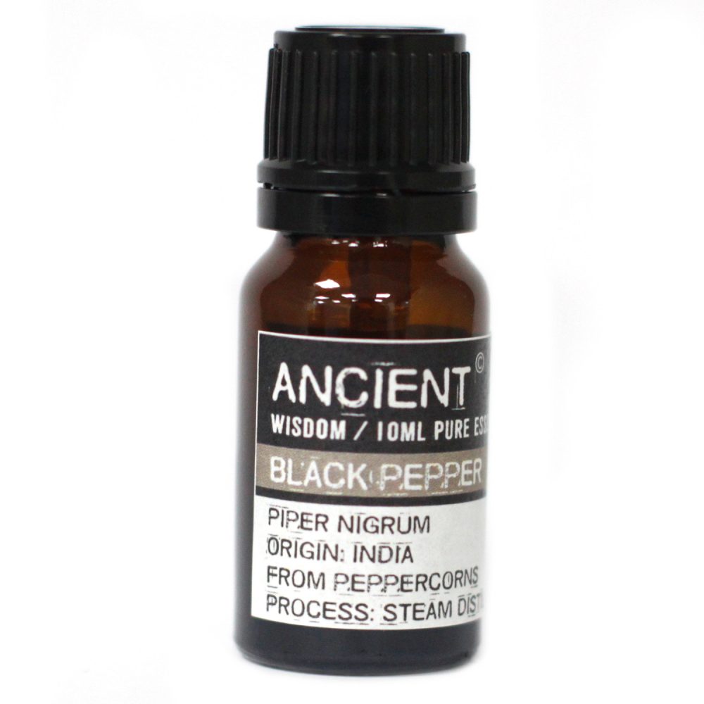A brown glass bottle with a black cap sits in a white space. The label reads: "ANCIENT, WISDOM/10ML PURE ESS, BLACK PEPPER, PIPER NIGRUM, ORIGIN: INDIA, FROM PEPPERCORNS, PROCESS: STEAM DIST."