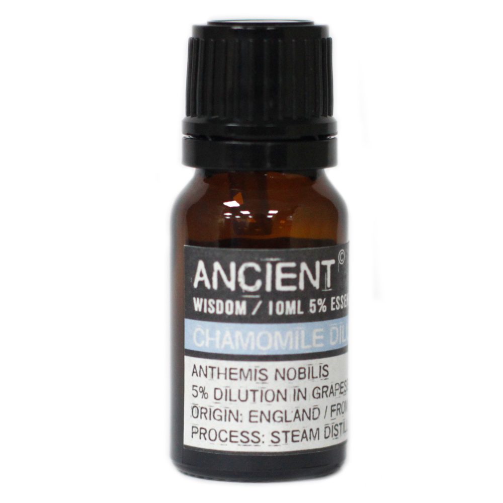 A brown glass bottle containing "ANCIENT WISDOM / 10ML 5% ESSE" "CHAMOMILE OIL" "ANTHEMIS NOBILIS 5% DILUTION IN GRAPES ORIGIN: ENGLAND/FRO PROCESS: STEAM DISTIL" rests on a white surface.