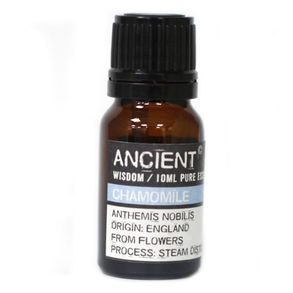A small amber bottle with a black cap sits on a white surface. A label reads "ANCIENT WISDOM/10ML PURE ESS CHAMOMILE ANTHEMIS NOBILIS ORIGIN: ENGLAND FROM FLOWERS PROCESS: STEAM DIST"