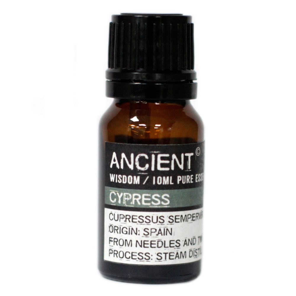A small amber bottle with a black cap stands upright. The label says "ANCIENT WISDOM / 10ML PURE ESS CYPRESS CUPRESSUS SEMPERV ORIGIN: SPAIN FROM NEEDLES AND T PROCESS: STEAM DIST".